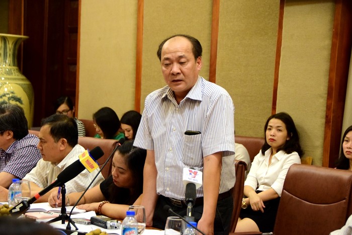 Ông Đỗ Ngọc Thọ - Phó trưởng ban thực hiện chính sách Bảo hiểm xã hội Việt Nam trao đổi thông tin tại hội nghị, ảnh: Hoàng Lực.
