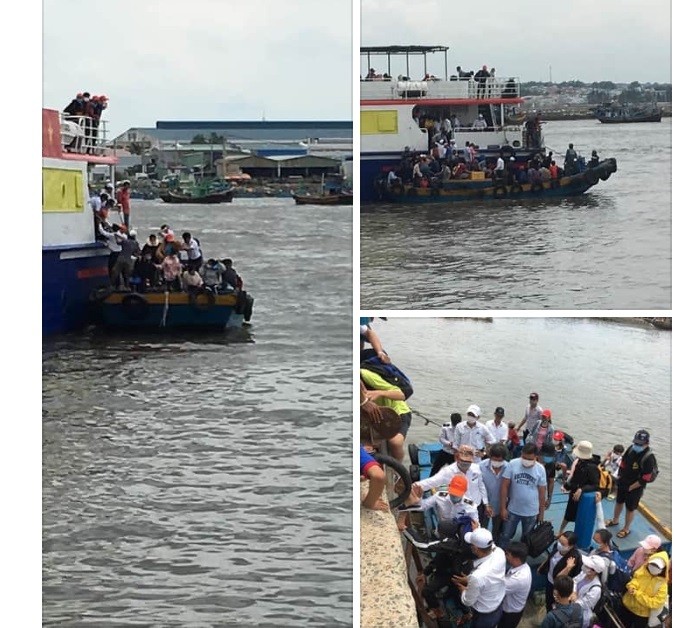 Tàu chở học sinh huyện đảo Phú Quý vào đất liền dự thi bị mắc cạn ngoài khơi nên phải dùng thuyền nhỏ chở học sinh vào bờ (Ảnh CTV)