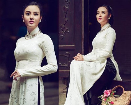 Áp dụng công thức của nhiều đàn chị, Hoa hậu Hoàn cầu thực hiện một bộ ảnh với tà áo dài Việt, hình ảnh của cô phần nào được cải thiện, nét đẹp duyên dáng ẩn hiện trong bộ ảnh thời trang đậm chất dân tộc.