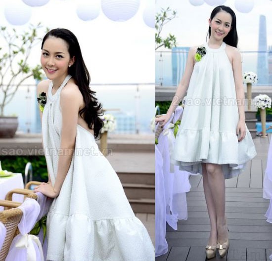 Chiếc váy trắng cổ yếm thiết kế xoè bồng bềnh khơi lên vẻ đẹp tinh khôi sang trọng của Linh Nga