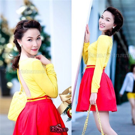 Chiếc áo vàng hở lưng được Quỳnh Thư mix cùng váy xoè đỏ tạo nên nét đẹpkiêu sa hiếm có.