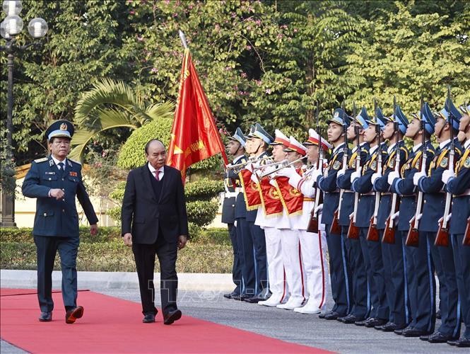 Chủ tịch nước Nguyễn Xuân Phúc duyệt đội danh dự Quân đội nhân dân Việt Nam. Ảnh: Thống Nhất/TTXVN