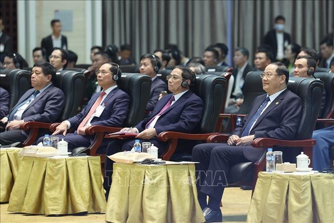 Thủ tướng Phạm Minh Chính và Thủ tướng Lào Sonexay Siphandone dự Lễ tổng kết Năm Đoàn kết hữu nghị Việt Nam - Lào, Lào - Việt Nam 2022. Ảnh: Dương Giang/TTXVN