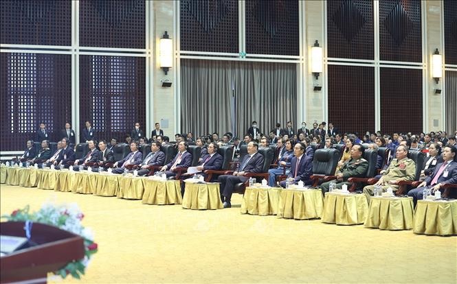 Thủ tướng Phạm Minh Chính, Thủ tướng Lào Sonexay Siphandone và các đại biểu dự Lễ tổng kết Năm Đoàn kết hữu nghị Việt Nam – Lào, Lào – Việt Nam 2022. Ảnh: Dương Giang/TTXVN