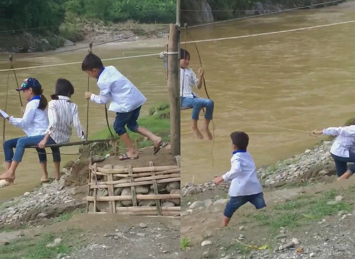 Cả ba cháu nhỏ cùng leo lên cáp treo đu qua suối mà không mặc áo phao. Ảnh: Cắt từ video.