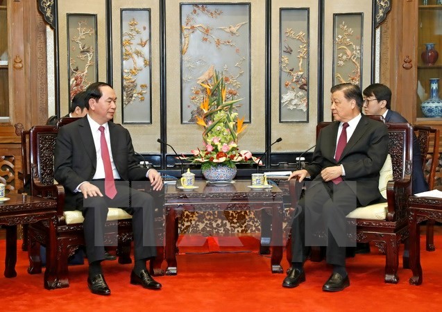 Chủ tịch nước Trần Đại Quang gặp Ủy viên Thường vụ Bộ Chính trị Trung ương Đảng Cộng sản Trung Quốc Lưu Vân Sơn. (Ảnh: Nhan Sáng/TTXVN)