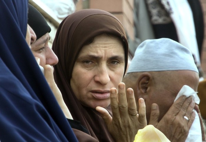 Sự đau buồn của người thân các nạn nhân trong vụ khủng bố ở Sinai (Ảnh: AP)