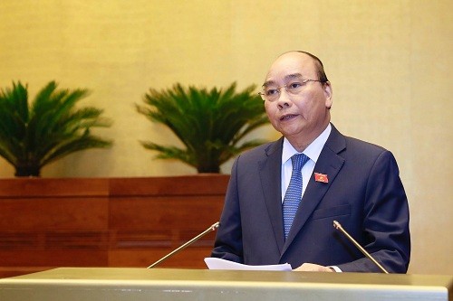 Thủ tướng Nguyễn Xuân Phúc trả lời chất vấn trước Quốc hội (Ảnh: VGP/Nhật Bắc)