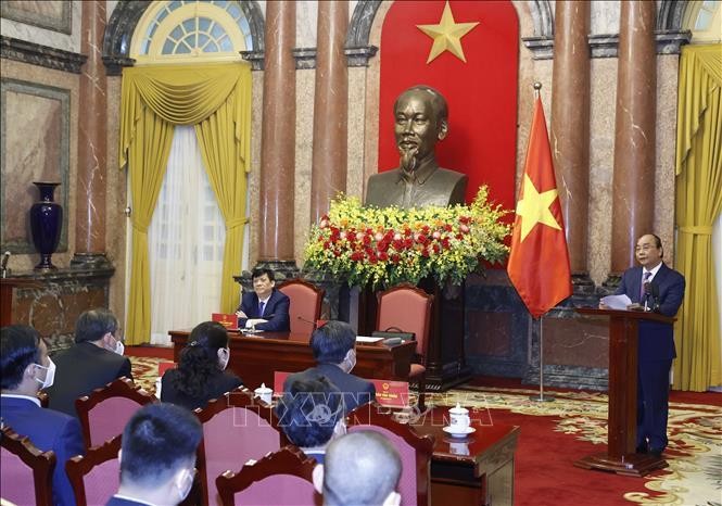 Chủ tịch nước Nguyễn Xuân Phúc phát biểu tại buổi gặp mặt. Ảnh: Thống Nhất/TTXVN