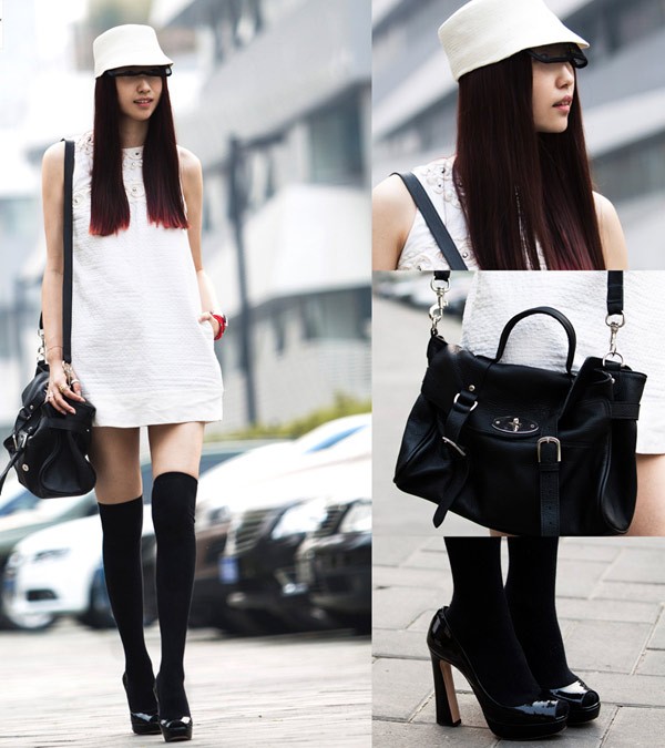 Váy oversized màu trắng ngang gối sẽ thật nổi bật khi bạn dùng các phụ kiện có tone màu đen đối lập.