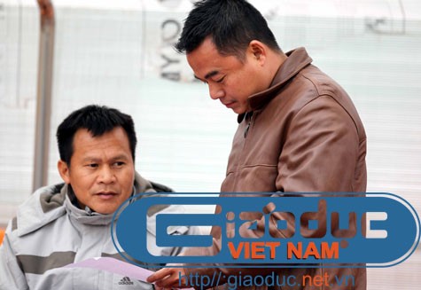 HLV Lư Đình Tuấn (trái) và Giám đốc điều hành Trần Tiến Đại (phải). Ảnh: Quang Minh