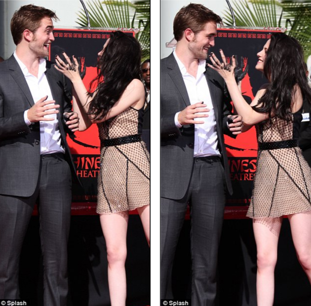 Cặp đôi Kristen Stewart và Robert Pattinson thu hút ống kính máy ảnh với những cử chỉ tình tứ.