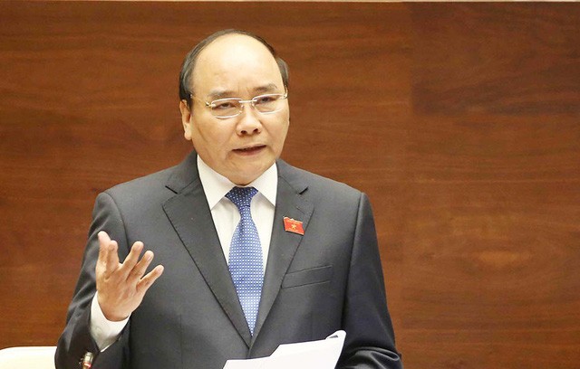 Thủ tướng Nguyễn Xuân Phúc đã có trả lời chất vấn của đại biểu Trần Thị Quốc Khánh. (Ảnh: Quochoi.vn)