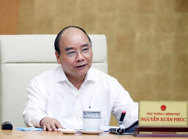 Thủ tướng Nguyễn Xuân Phúc chủ trì cuộc họp. Ảnh: Thống Nhất/ TTXVN