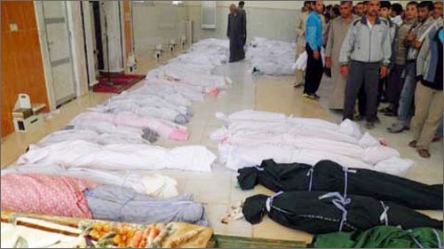 Thi thể trẻ em thiệt mạng trong cuộc thảm sát mới nhất tại Houla, Syria. Ảnh: AFP.