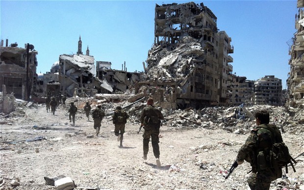Binh lính quân chính phủ Syria kiểm soát quận Khalidiya, trung tâm thành Homs.