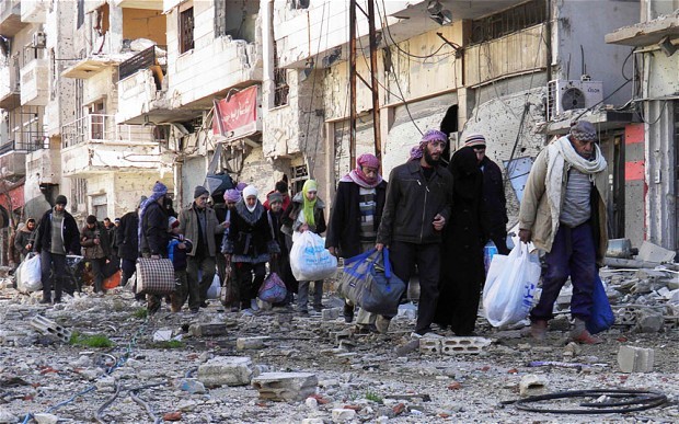 Những người dân thành Homs, Syria đang sống trong lửa đạn.