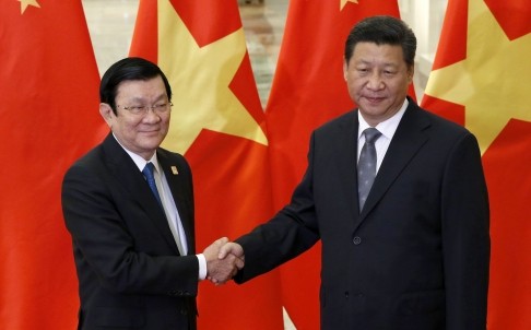 Chủ tịch nước Trương Tấn Sang và Chủ tịch Trung Quốc Tập Cận Bình bên lề diễn đàn APEC. Ảnh: South China Morning Post.