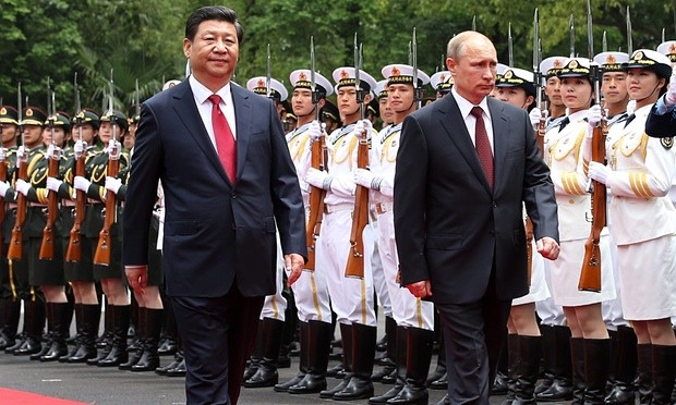 Tổng thống Nga Putin và Chủ tịch Trung Quốc Tập Cận Bình. Ảnh: The Guardian.