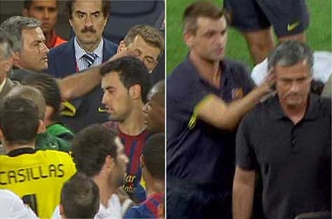 Mourinho chọc mắt Vilanova (trái) để trả đũa có tát tai trước đó của vị trợ lý Barca