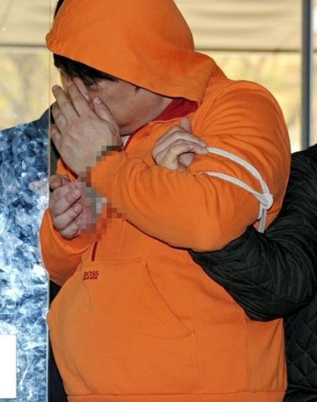 Jang Seok Woo bị cảnh sát Hàn Quốc bắt giữ hồi tháng 5/2012.