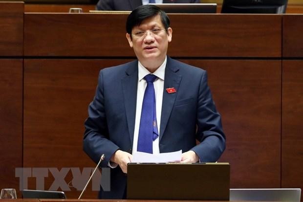 Bộ trưởng Bộ Y tế Nguyễn Thanh Long trả lời các câu hỏi chất vấn của đại biểu Quốc hội. (Ảnh: TTXVN)