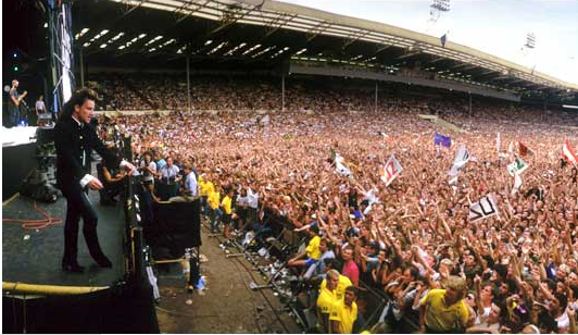 Với gần bốn năm liên miên thu âm và lưu diễn, với những album, single tiêu thụ ngày một nhiều, U2 tạm ngưng ở vị trí siêu sao quốc tế vào giữa thập niên, chủ yếu biểu diễn trong các live show từ thiện. Chương trình Live Aid quyên góp tiền cho người dân bị đói Ethiopia tháng 7/1985 đã có sự tham gia của họ, thu hút hơn một tỉ người xem. Với bản phóng tác của ''Bad'' kéo dài 13 phút, Bono đã làm cả sân vận động Wembley Stadium nhảy múa theo.