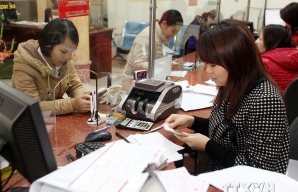 Ngân hàng Nhà nước Việt Nam chuẩn bị Tờ trình của Chính phủ về dự thảo Nghị quyết về xử lý nợ xấu của các tổ chức tín dụng (lần 2). ảnh minh họa: TTXVN.