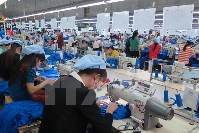 Xếp hạng môi trường kinh doanh của Việt Nam tăng nhiều bậc nhờ vào sự nỗ lực trong công tác điều hành của Chính phủ. ảnh: TTXVN.