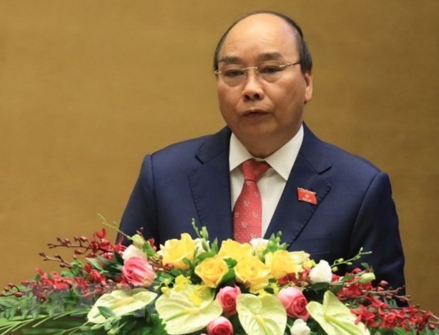 Thủ tướng Nguyễn Xuân Phúc trình bày báo cáo tình hình thực hiện Kế hoạch phát triển kinh tế - xã hội năm 2020 và 5 năm 2016-2020; dự kiến Kế hoạch năm 2021 và phương hướng, nhiệm vụ 5 năm 2021-2025. Ảnh: Văn Điệp/TTXVN.