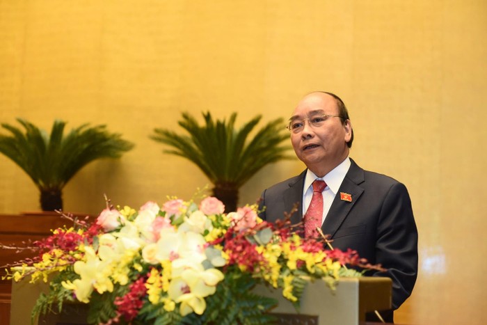 Thủ tướng Nguyễn Xuân Phúc trình bày báo cáo của Chính phủ nhiệm kỳ 2016-2021 tại Quốc hội sáng 24/3. ảnh: Nhật Bắc/VGP.