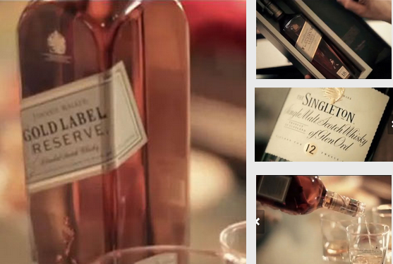 Hình ảnh cận kề, rõ nét các chai rượu, logo nhãn hàng quá lộ liễu trong MV của Hà Hồ (ảnh chụp từ Clip).