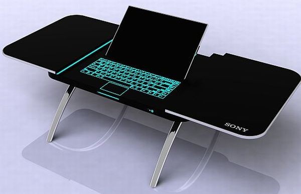 6. Bàn sony đa năng Chiếc bàn đa năng này xuất phát là bàn cà phê nhỏ nhắn và được lắp thêm một màn hình laptop và được làm từ chất liệu nhôm màu đen sang trọng với chân bàn uốn cong thời trang. Mặt bàn được thiết kế với hai nửa trượt sang bên chỉ bằng một nút nguồn. Phần máy tính gồm một bàn phím cảm ứng, ổ đĩa DVD, tai nghe và màn hình có thể điều chỉnh linh hoạt. Đây là mẫu thiết kế của ZyaneTan, người Singapore và nó thực sự là sự kết hợp tuyệt vời giữa công nghệ và đồ nội thất