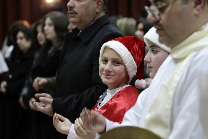 Các Kito hữu cầu nguyện trong đêm Giáng sinh tại nhờ thờ Chadean Catholic ở Amman, Iraq