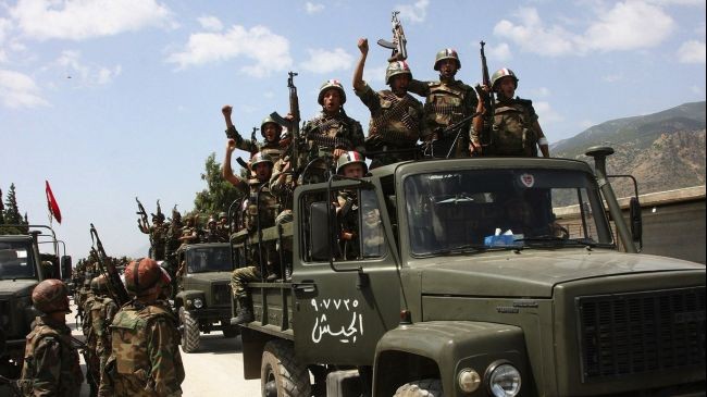 Quân đội Syria ăn mừng sau khi lấy lại được thị trấn chiến lược.