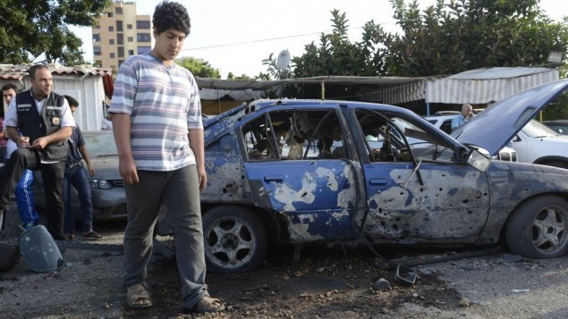 Một chiếc xe bị phá hủy trong cuộc tấn công tên lửa của phiến quân Syria hôm 1/6 ở Li Băng.