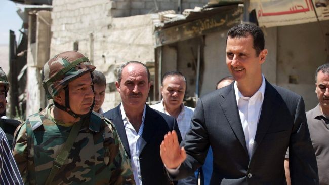Tổng thống Syria Bashar al-Assad (phải)