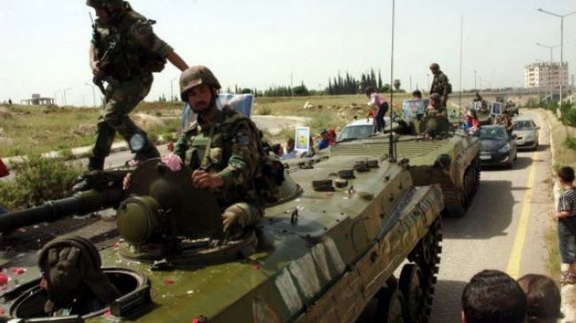 Quân đội Syria tiến vào vùng giải phóng với hoa mừng chiến thắng